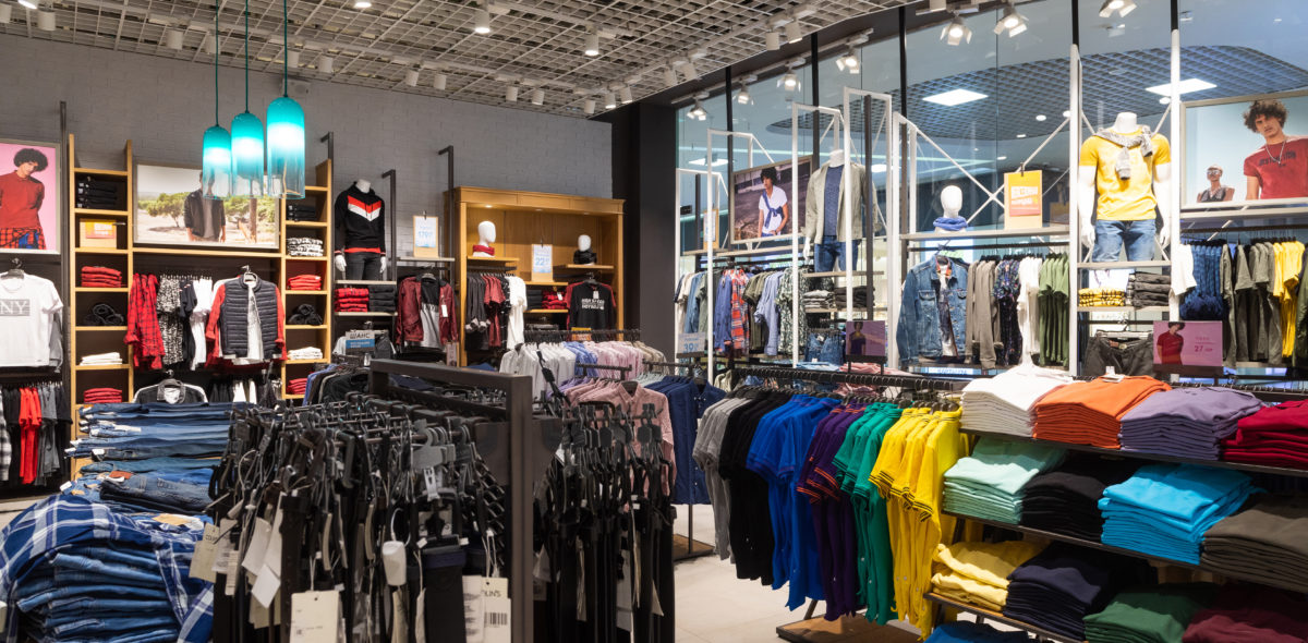 Minsk, Belarus - May 29, 2019: interior shot of racks with shirts, undershirts and jeans